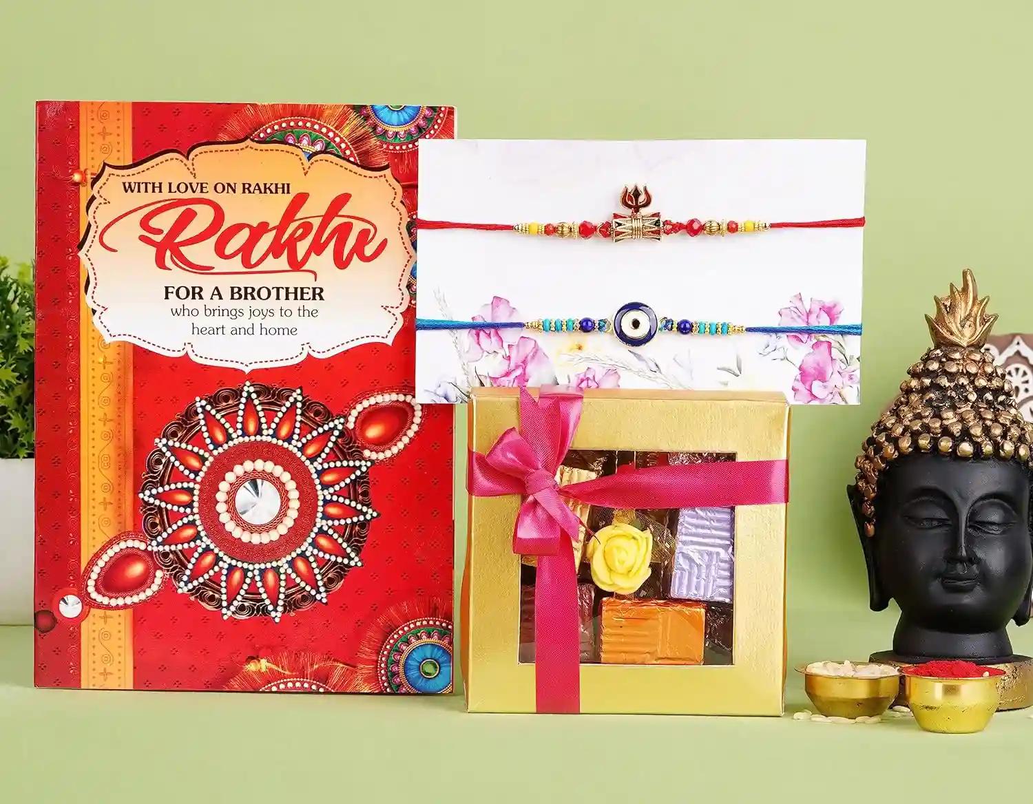 Rakhi For Brother With Chocolate/Rakhi For Brother With Gift/Rakhi For Brother And Bhabhi/Rakhi Gift For Brother-2 Gold Plated Rakhi+Showpiece Figurine+Roli, Chawal+Rakhi Greeting Card