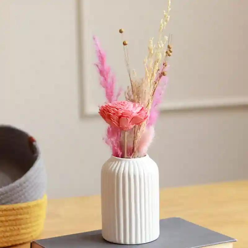 Snow white vase with aroma bunch