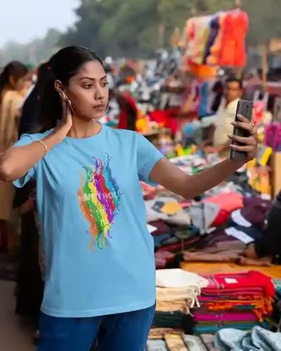 Celebrate Joyfully: Women's Colorful Happy Holi T-Shirt in Vivid Splashes | 100% Premium Bio Wash Cotton T-Shirts - S  (Light Blue)